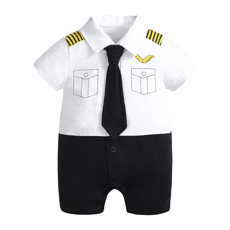 Barboteuse bébé style capitaine, blanche et noire, avec cravate noire et motifs d’épaule jaunes.